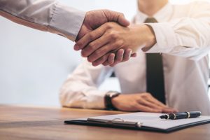 real estate broker shaking hands